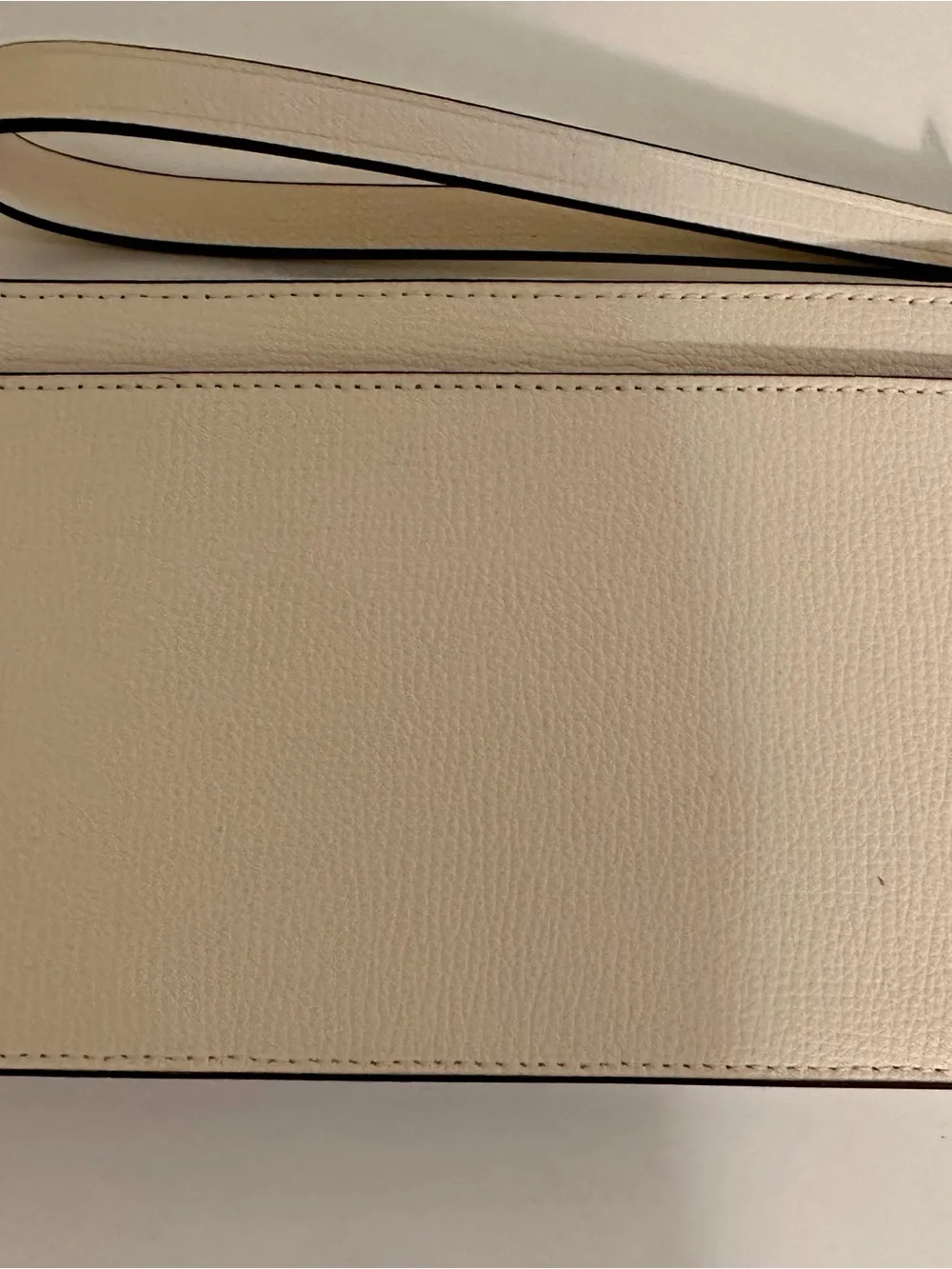 Kate Spade white wristlet with lilac floral appliqués and green leaves